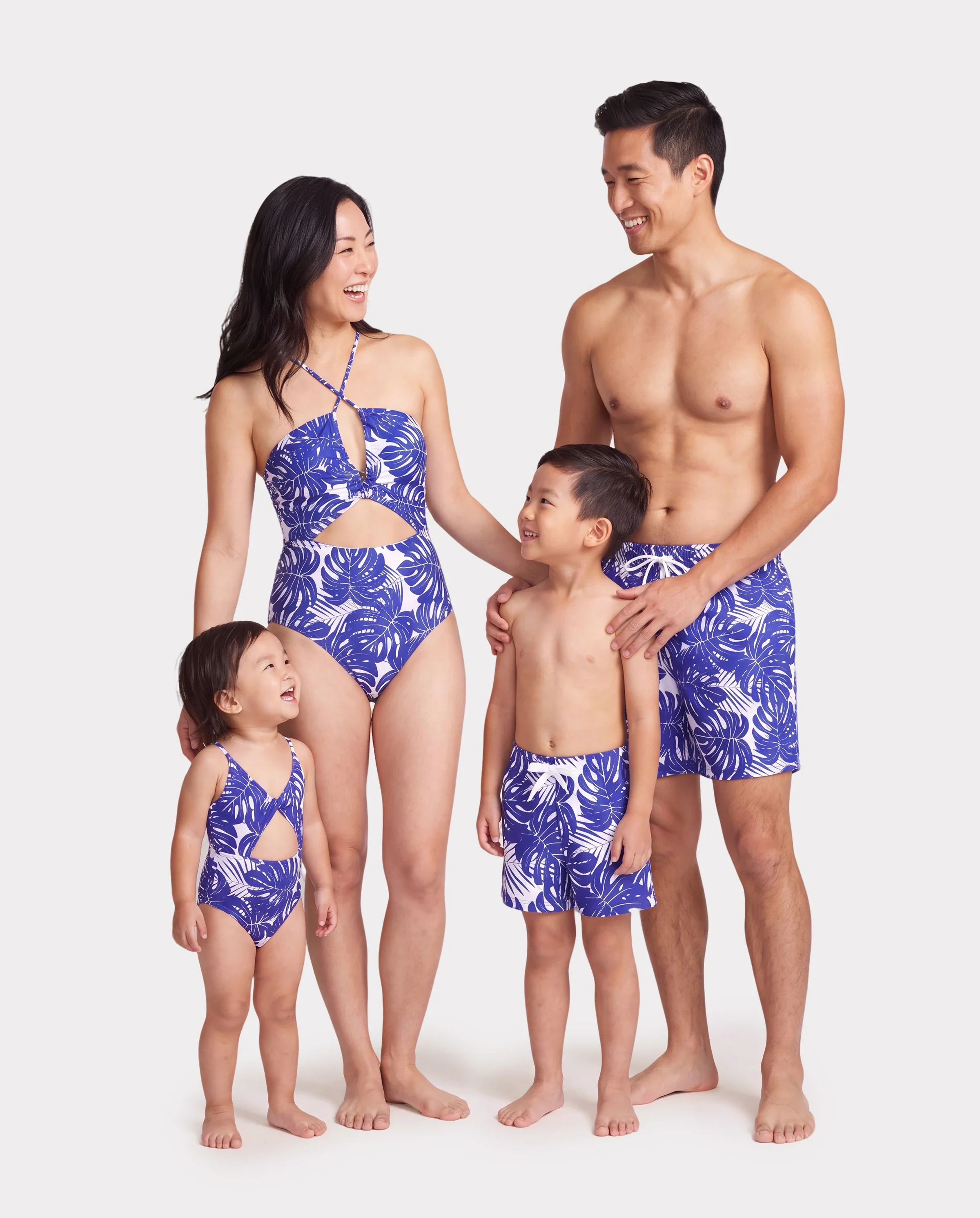Family Matching Tropical Leaf Print Swim Trunks or Hollow-out Crisscross Straps One-piece Swimsuit Blue